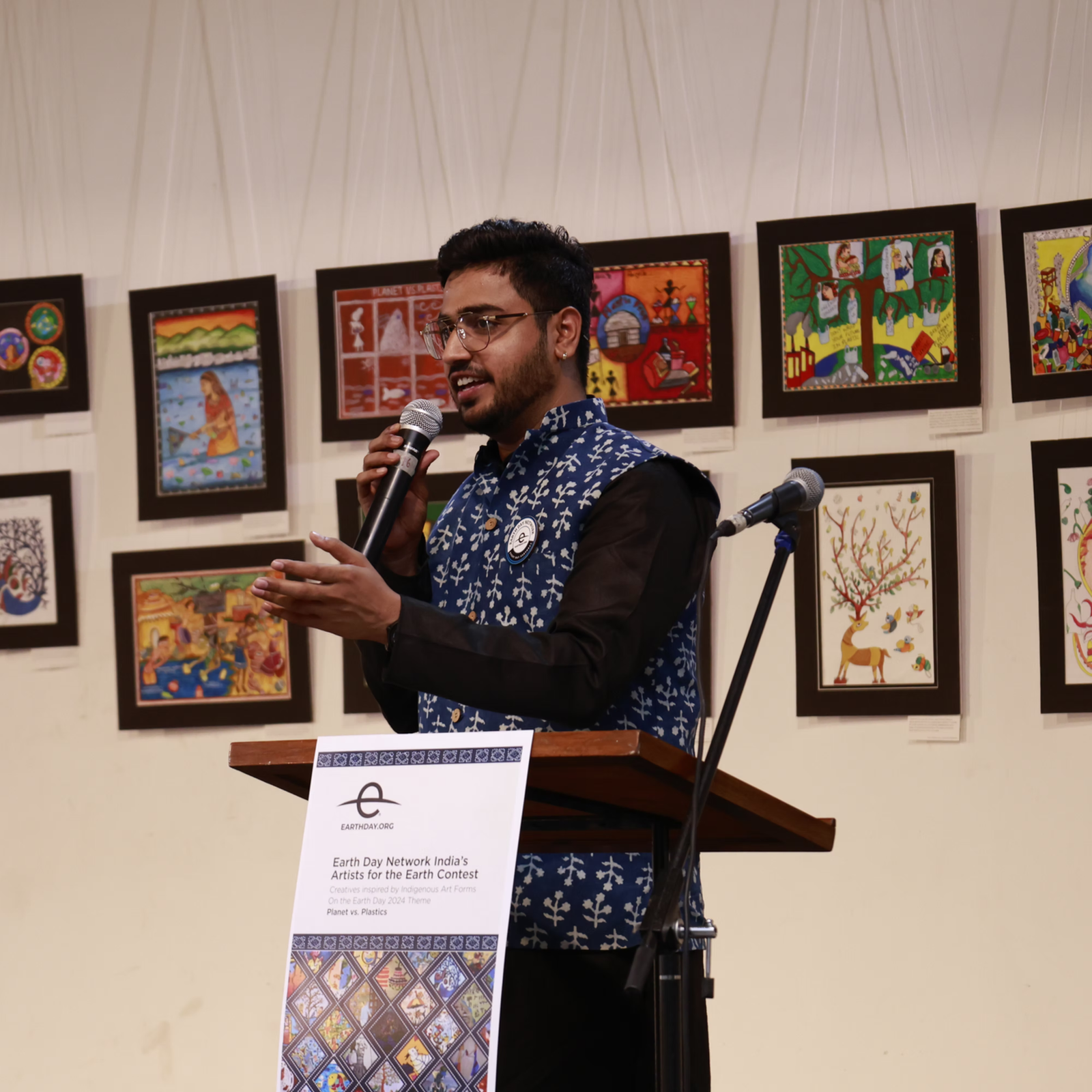 Rumit addressing participants at an Earth Day initiative